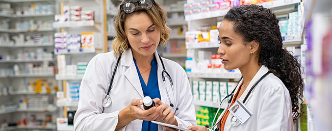 Two female pharmacist talking about a prescription
